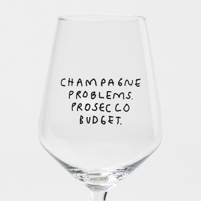 Weinglas Champagne Problems. Prosecco Budget.